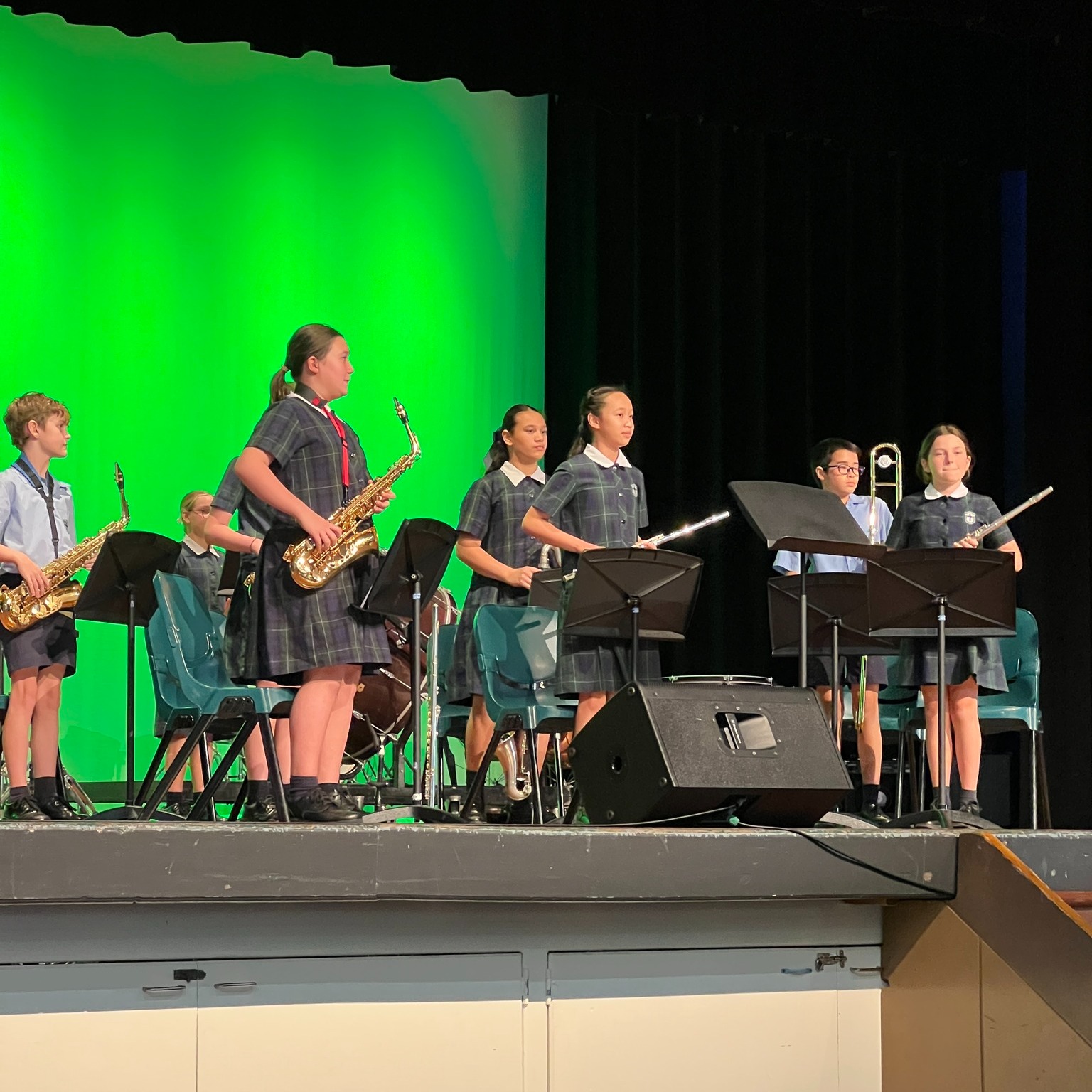 School band students performing on stage.